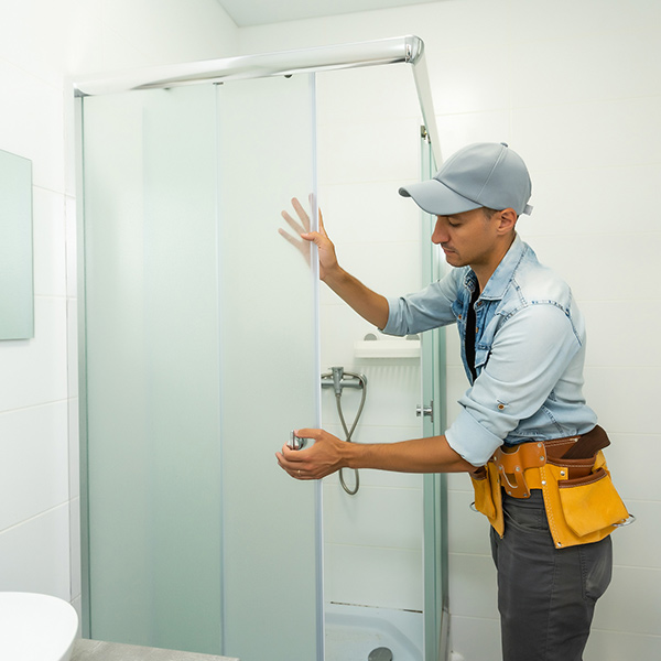 plumber working in shower